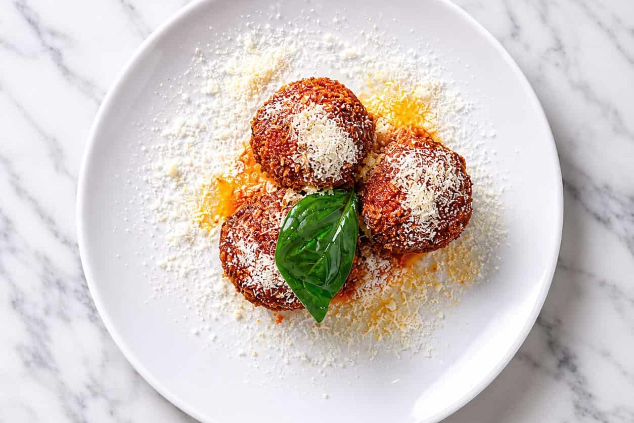 Arancini Bolognese - Slow Cooked Veal & Pork Bolognese, Peas, Buffalo Mozzarella