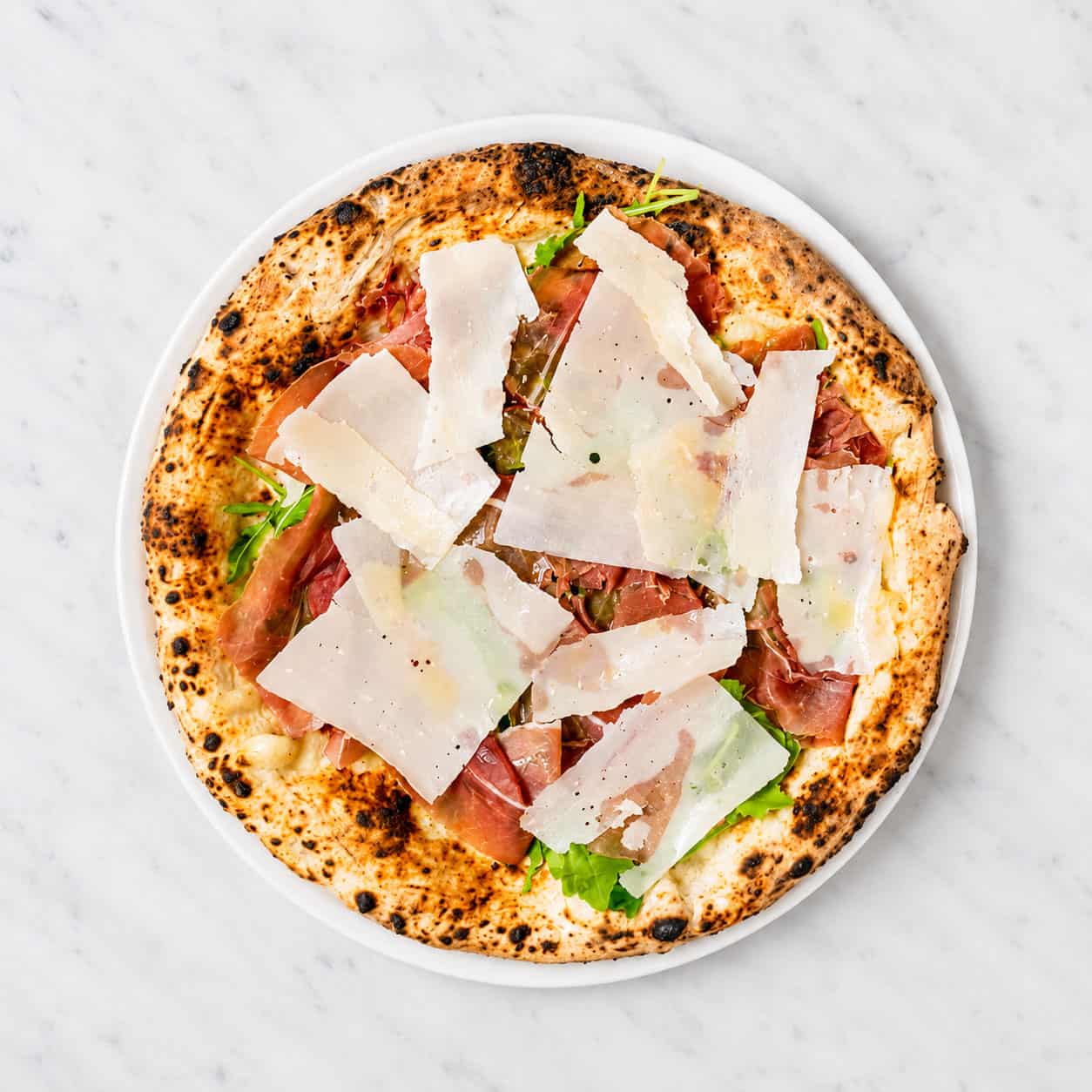 Crudo e Rucola - White base, Fior di Latte, Rocket, Prosciutto di Parma, Grana Padano DOP, EVOO