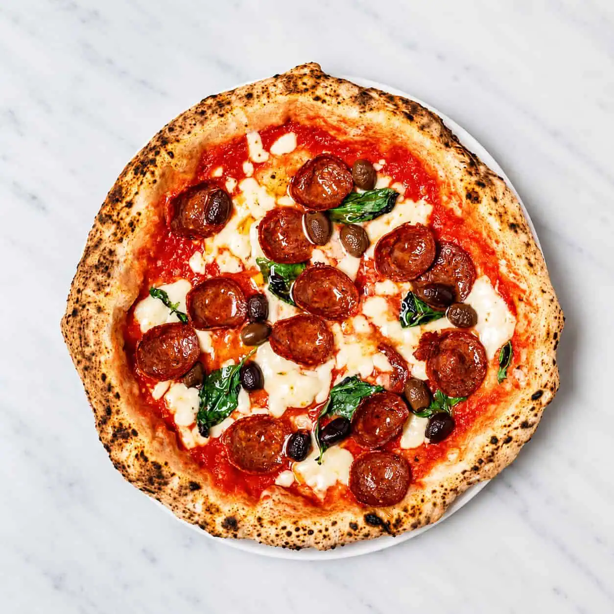 Diavola Pizza - Solania San Marzano, Fior di Latte, Hot Salami, Gaeta Black Olives, Pecorino Romano, Basil, EVOO
