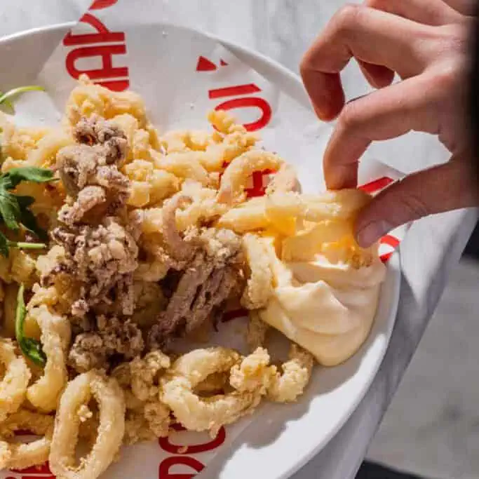 Crispy flash-fried locally sourced calamari served with a side of zesty lemon mayo
