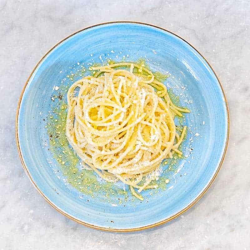 Kids spaghetti served with grated cheese and olive oil, available with Bolognese, Napoli, cream, or oil & cheese at Via Napoli