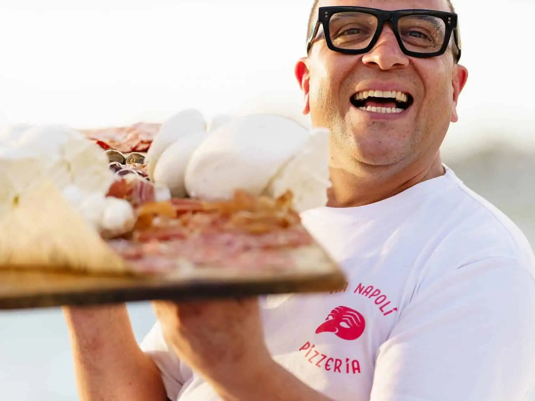 Luigi Esposito Via Napoli serving wood-fired neapolitan pizza