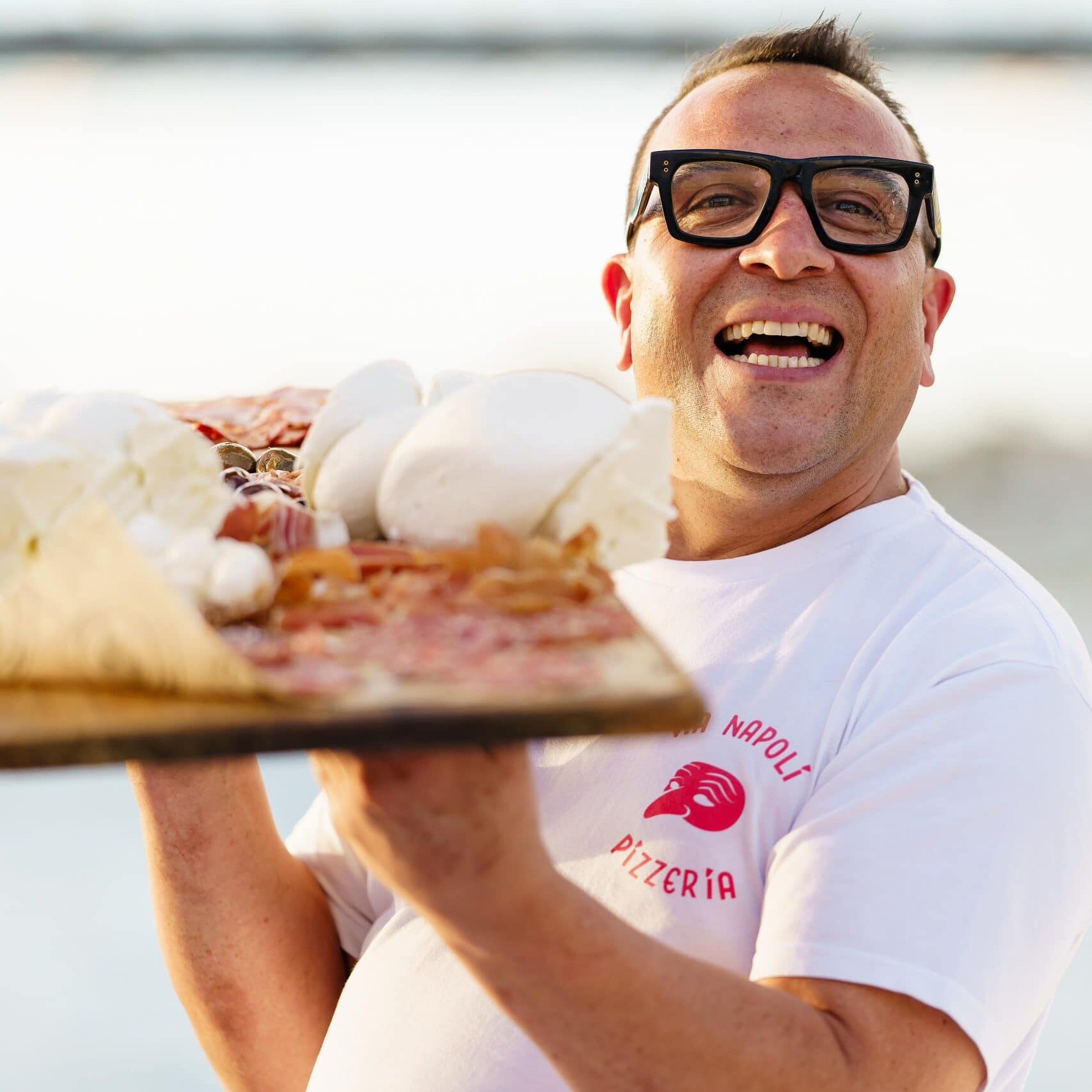 Luigi Esposito Via Napoli serving wood-fired neapolitan pizza