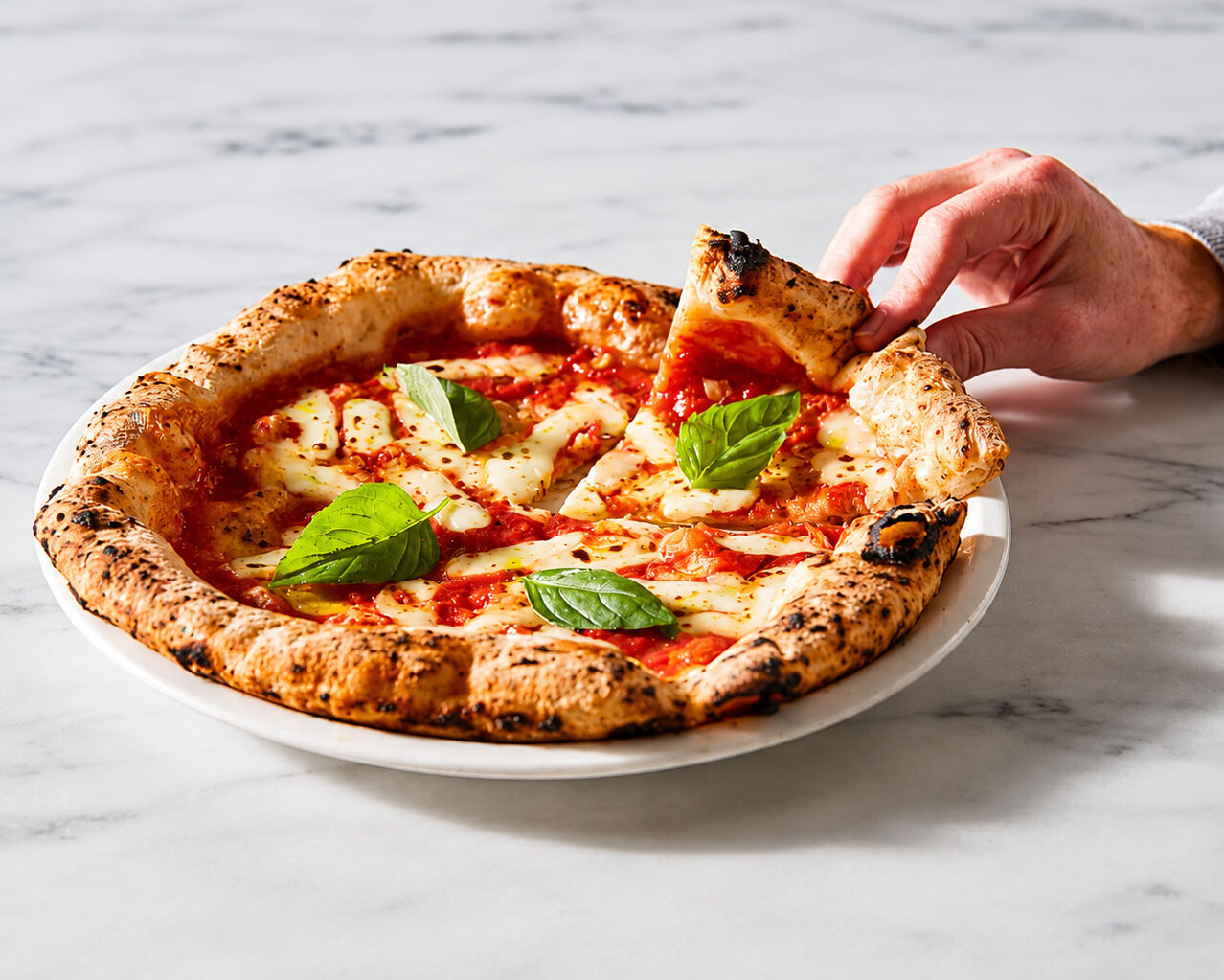 Margherita pizza slice lifted Neapolitan style Via Napoli