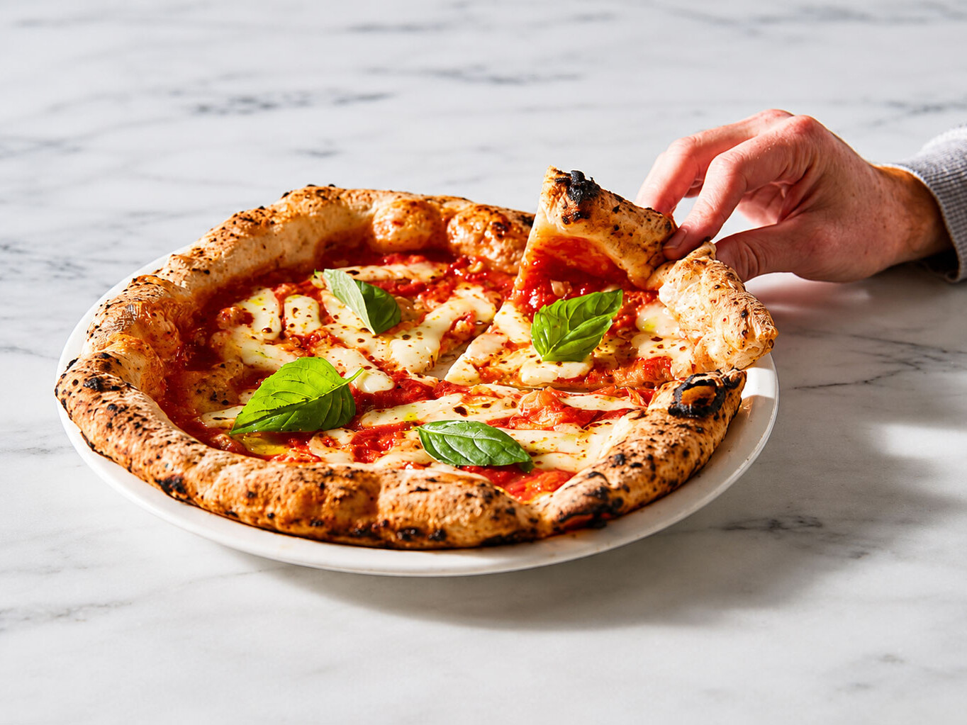 Margherita pizza slice lifted Neapolitan style Via Napoli