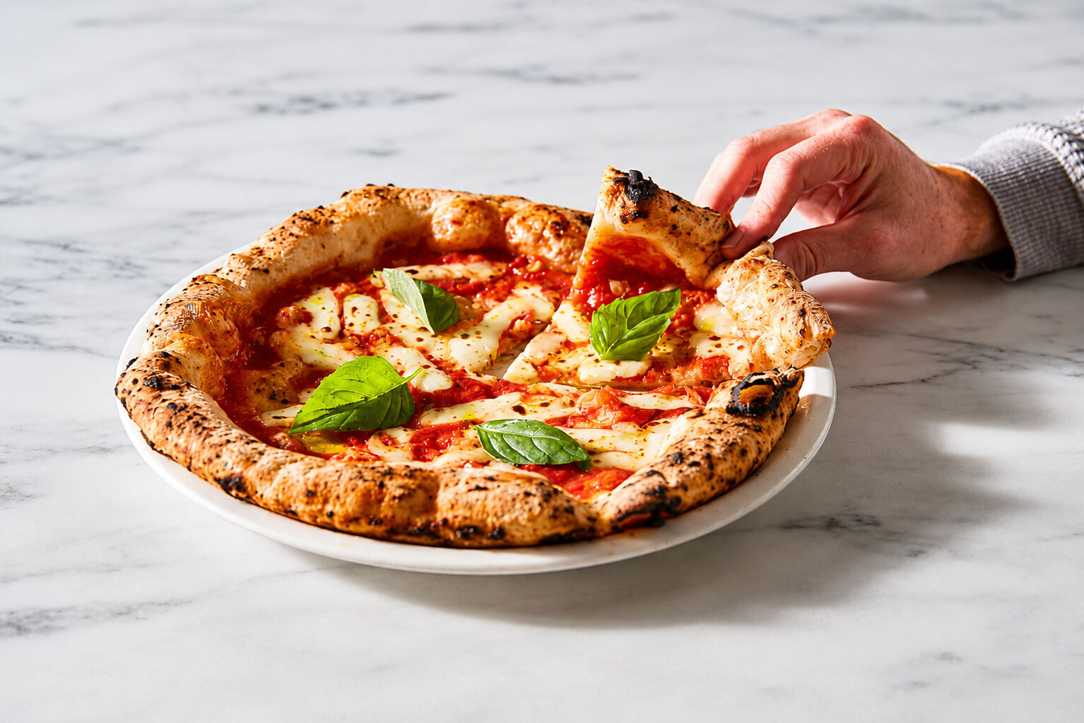 Margherita pizza slice lifted Neapolitan style Via Napoli