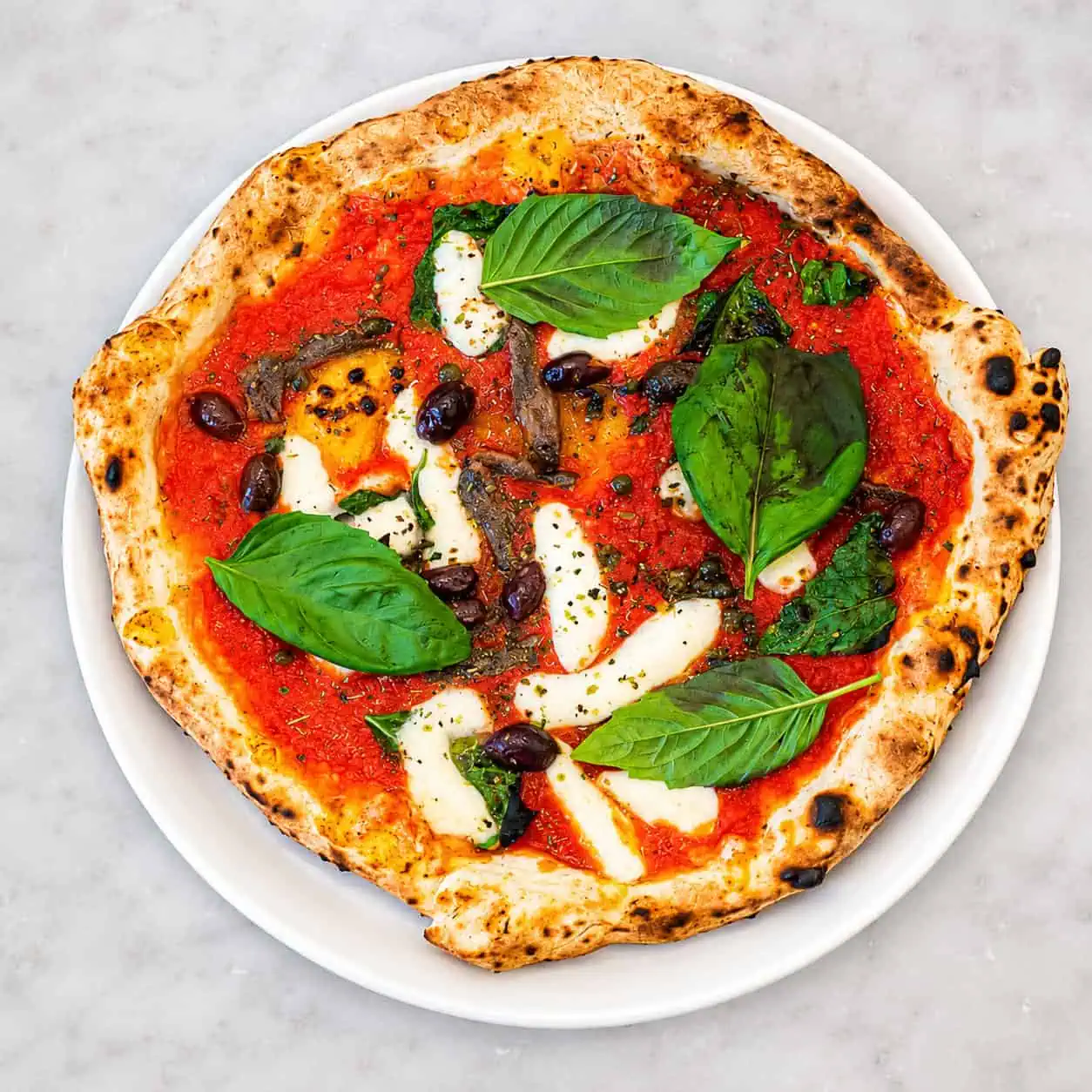 Napoletana Pizza - Solania San Marzano, Fior di Latte, Cetara Anchovies, Gaeta Black Olives, Capers, Oregano, Basil, EVOO