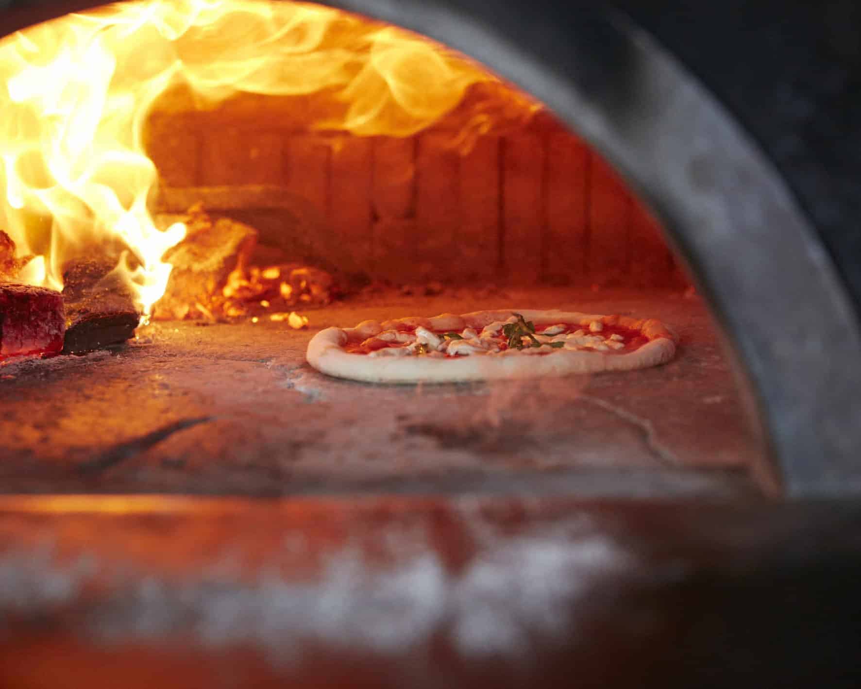 Neapolitan pizza wood fired oven baking Via Napoli