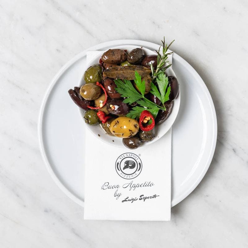 Bowl of warm marinated Italian Gaeta olives served as a traditional appetiser