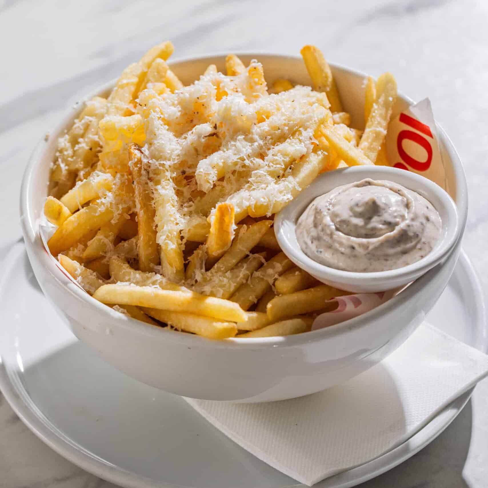 Crispy fries topped with shaved truffle pecorino cheese