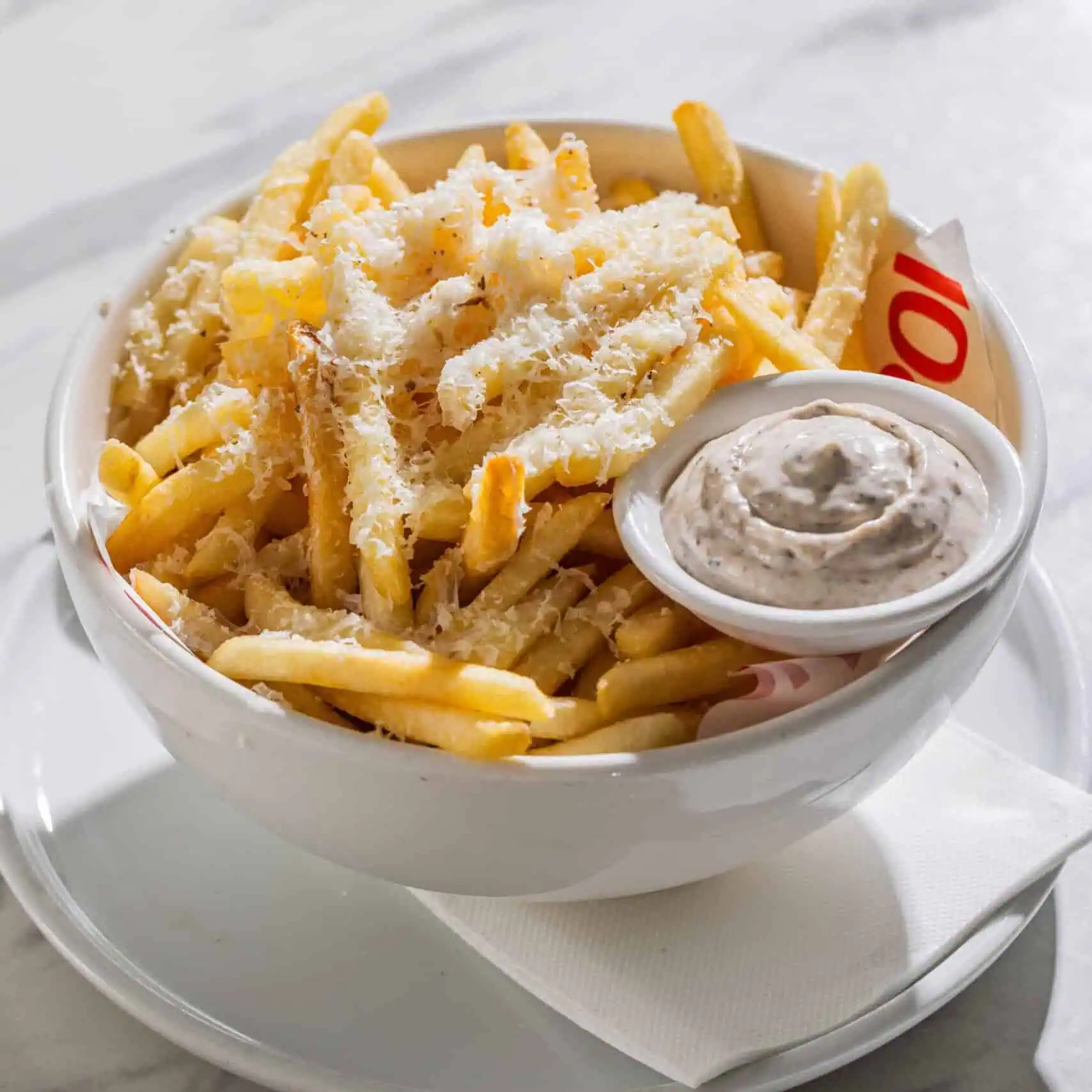 Crispy fries topped with shaved truffle pecorino cheese