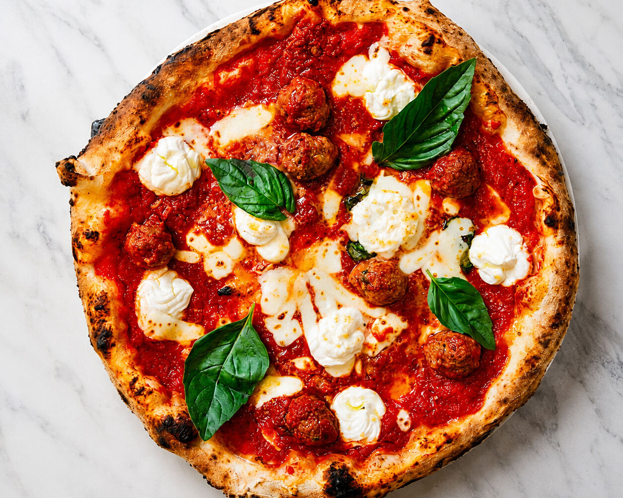 Pizza Lasagna - Solania San Marzano, Fior di Latte, Buffalo Ricotta, Nonna Giuseppina’s Beef Meatballs, Pecorino Romano, Basil, EVOO