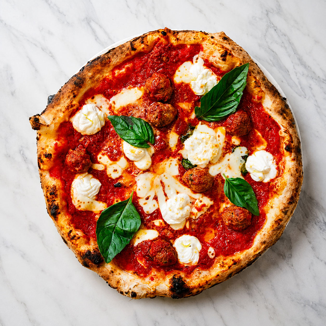 Pizza Lasagna - Solania San Marzano, Fior di Latte, Buffalo Ricotta, Nonna Giuseppina’s Beef Meatballs, Pecorino Romano, Basil, EVOO