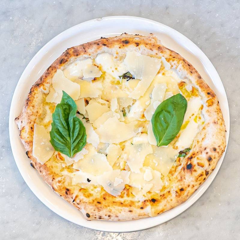 Quattro Formaggi pizza topped with fior di latte, gorgonzola, scamorza, and Parmigiano Reggiano cheese
