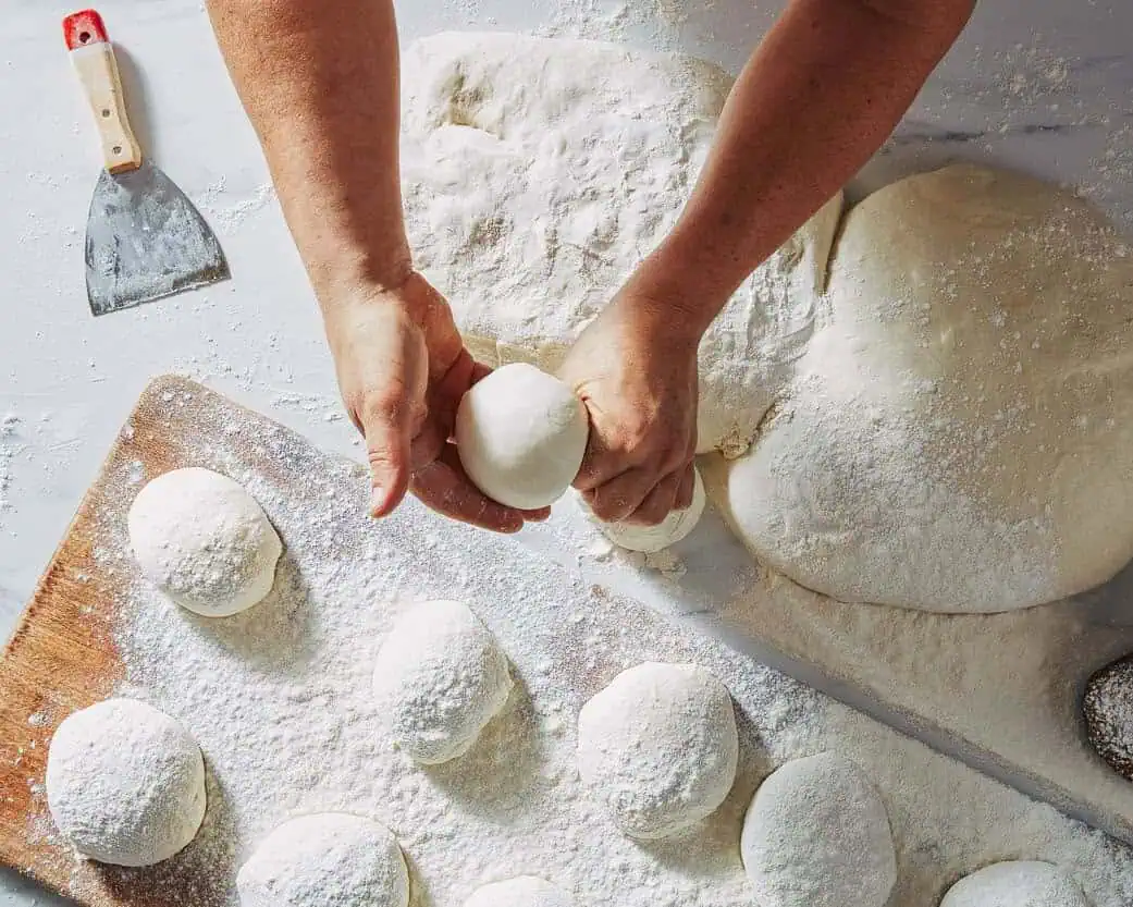 Shaping pizza dough balls artisan baking process Via Napoli