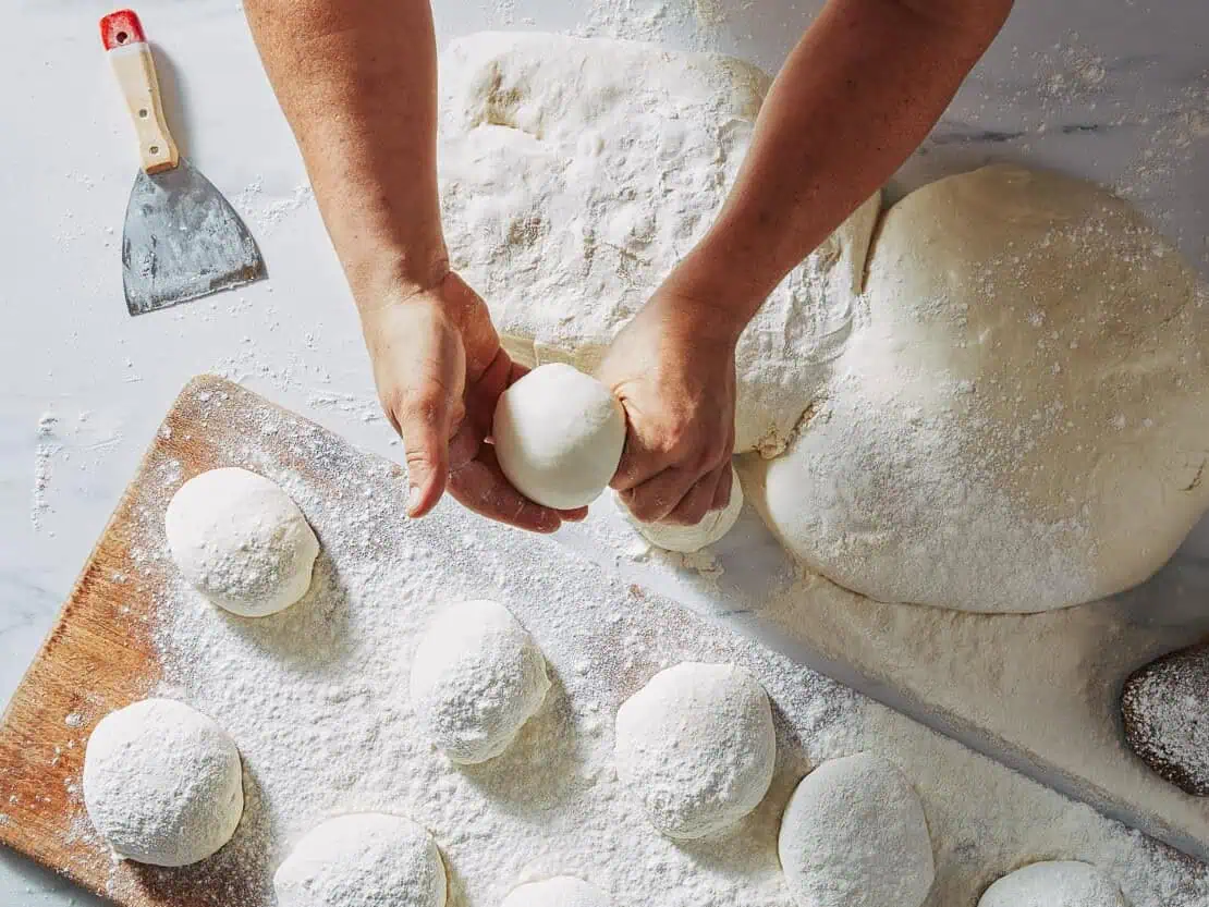 Shaping pizza dough balls artisan baking process Via Napoli