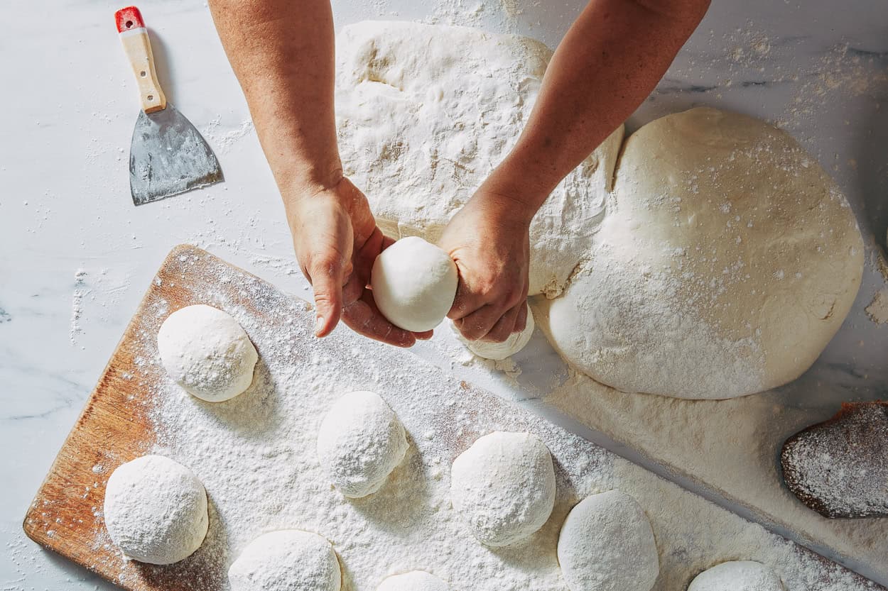Shaping pizza dough balls artisan baking process Via Napoli