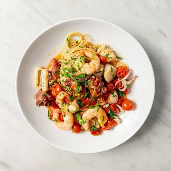 Spaghetti Marechiaro pasta with prawns, Hawkesbury River calamari, Victorian scallops, mussels, vongole, chilli, garlic, and cherry tomato truss sauce