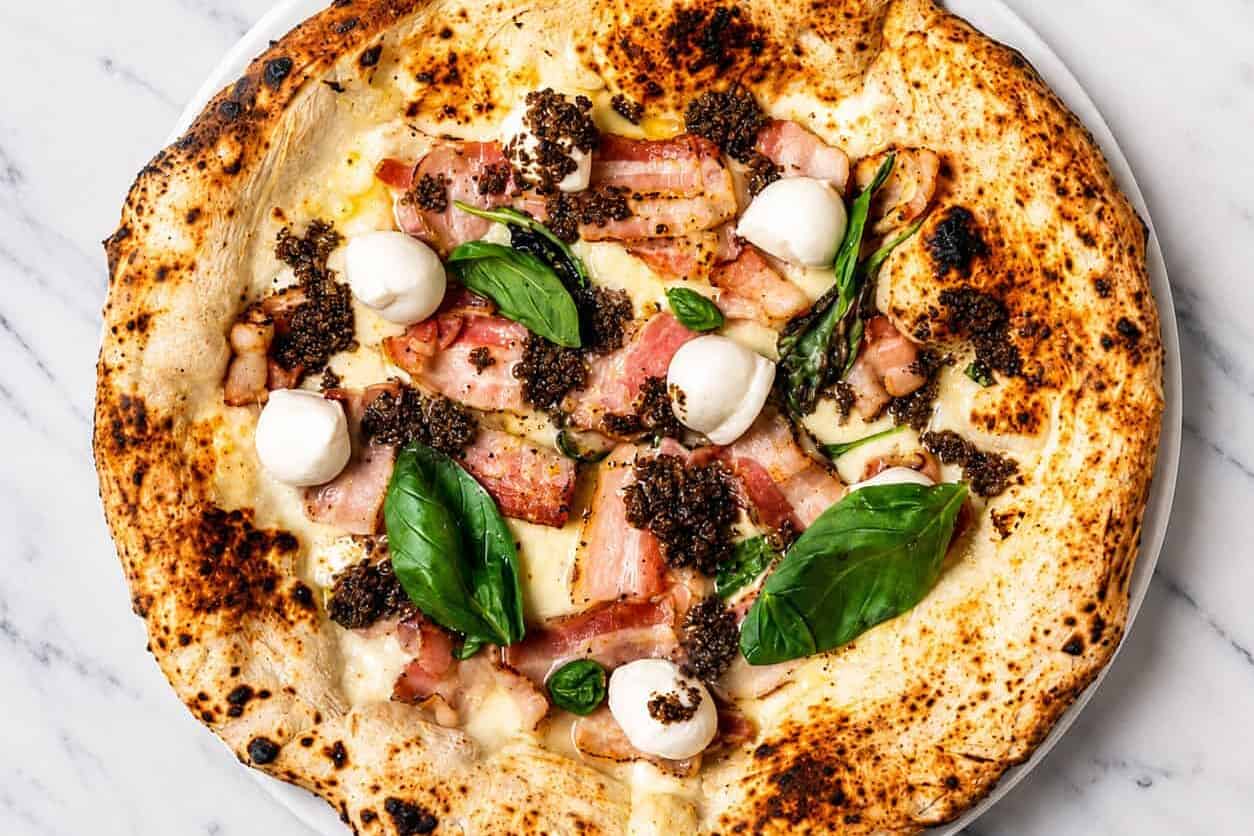 Truffle Pizza - White Base, Buffalo Mozzarella, Pancetta, Black Truffle, Buffalo Bocconcini, Basil, EVOO