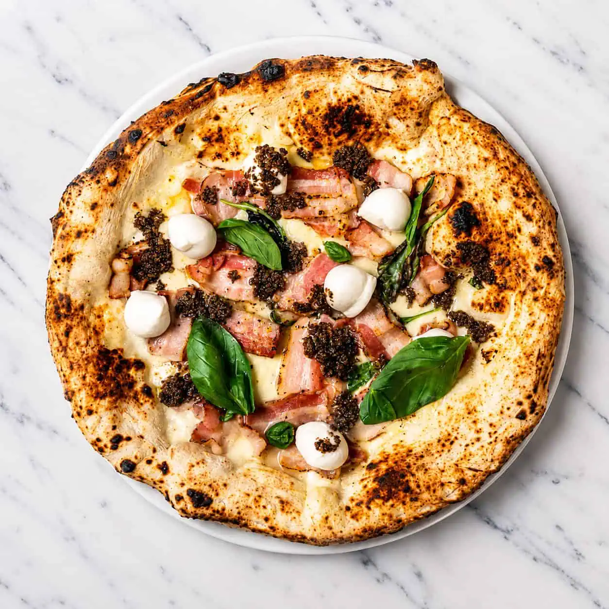 Truffle Pizza - White Base, Buffalo Mozzarella, Pancetta, Black Truffle, Buffalo Bocconcini, Basil, EVOO